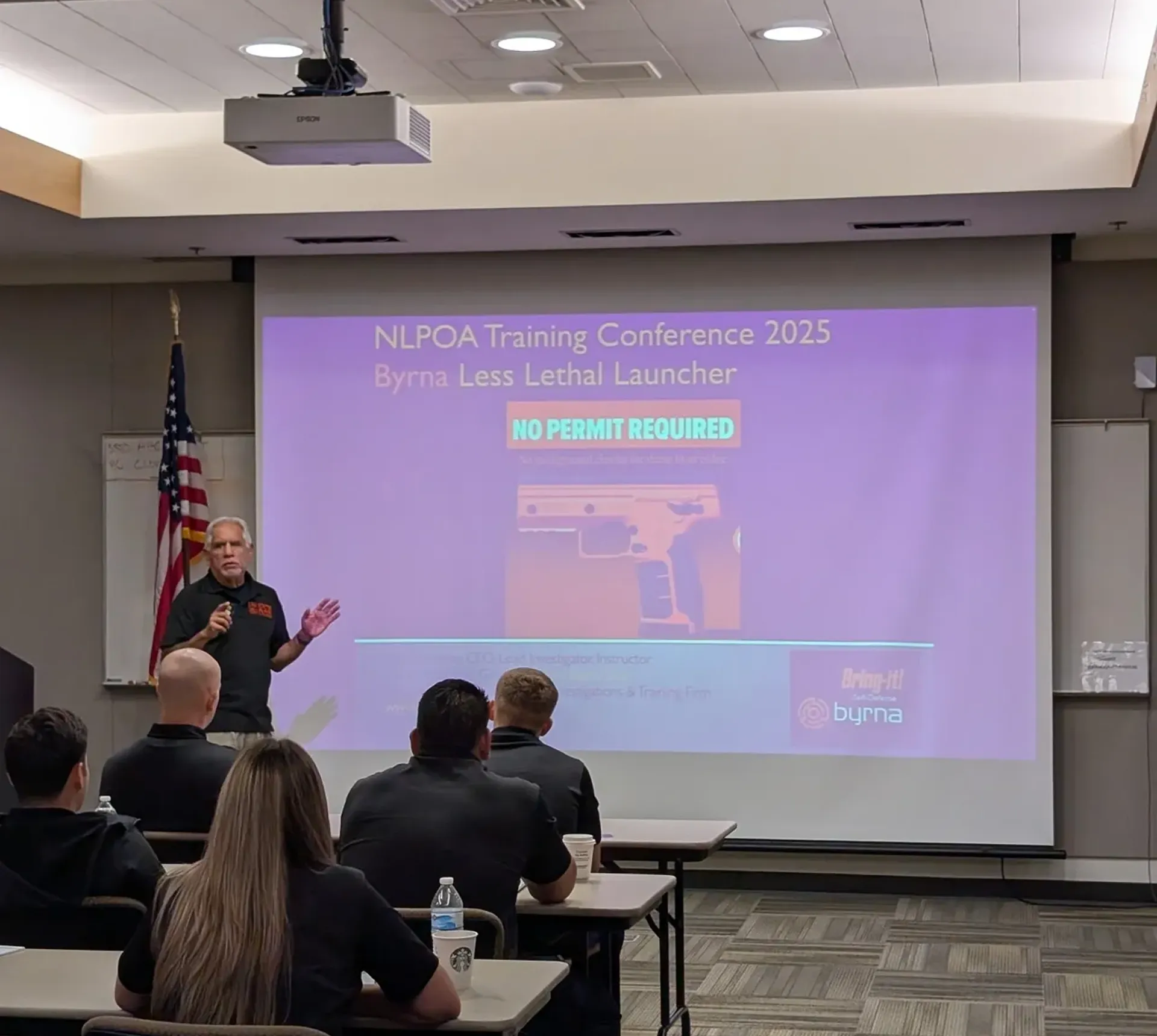 Man presenting at a training conference.