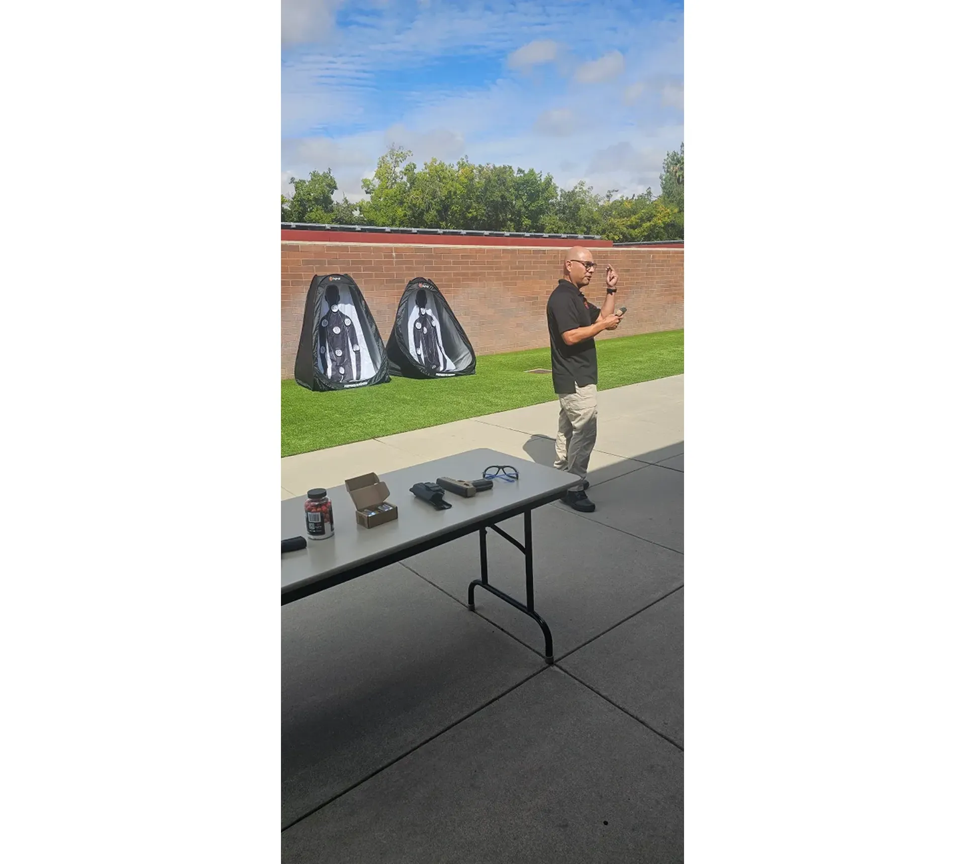 Person giving outdoor demonstration with equipment.