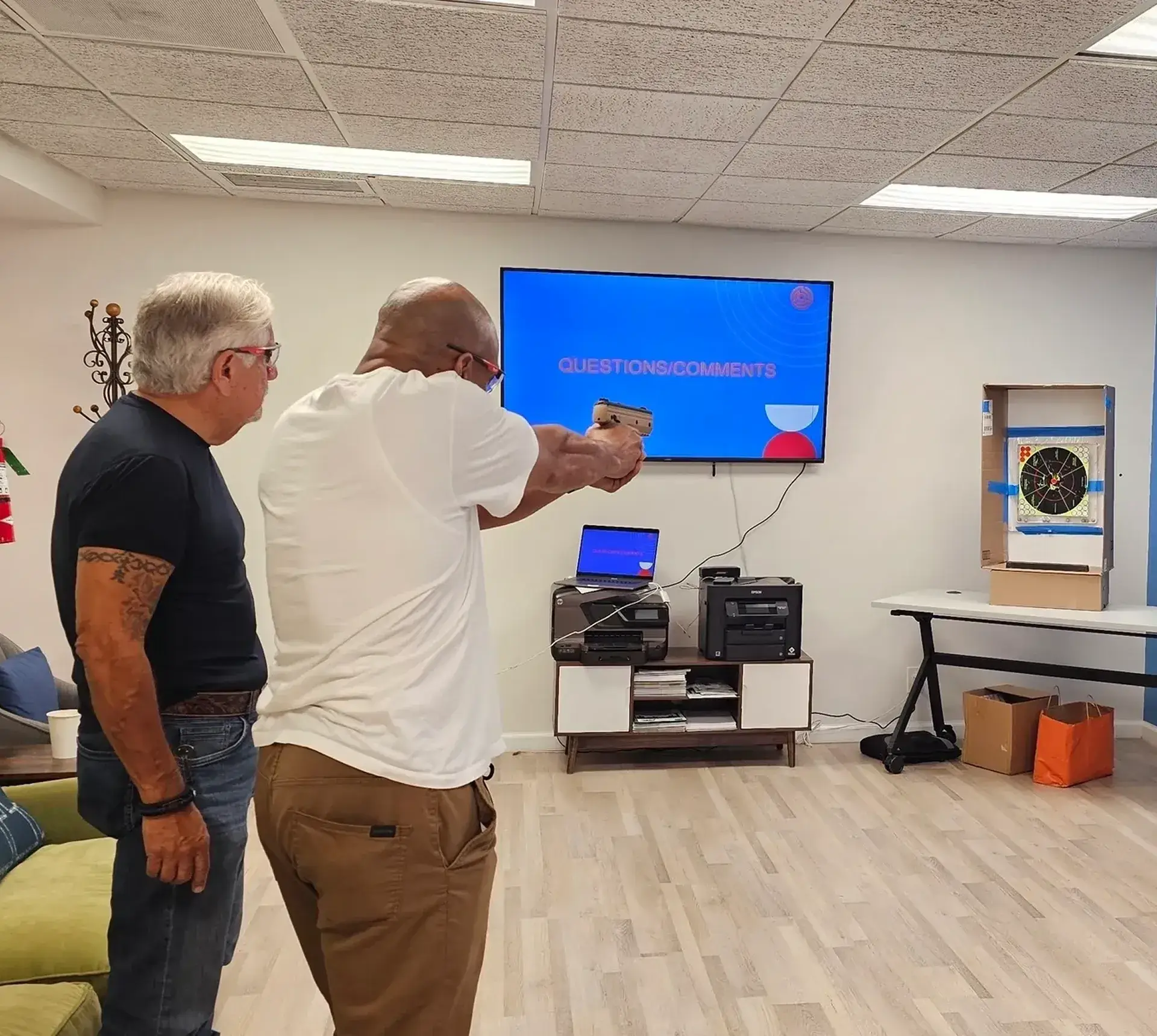 Two men playing darts indoors.