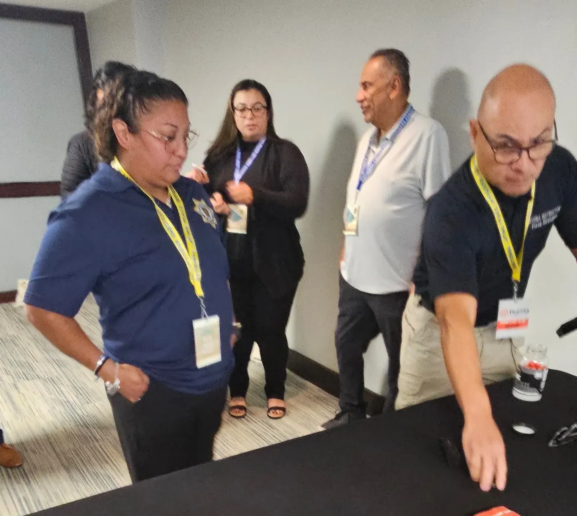 People gathered in a conference room setting.