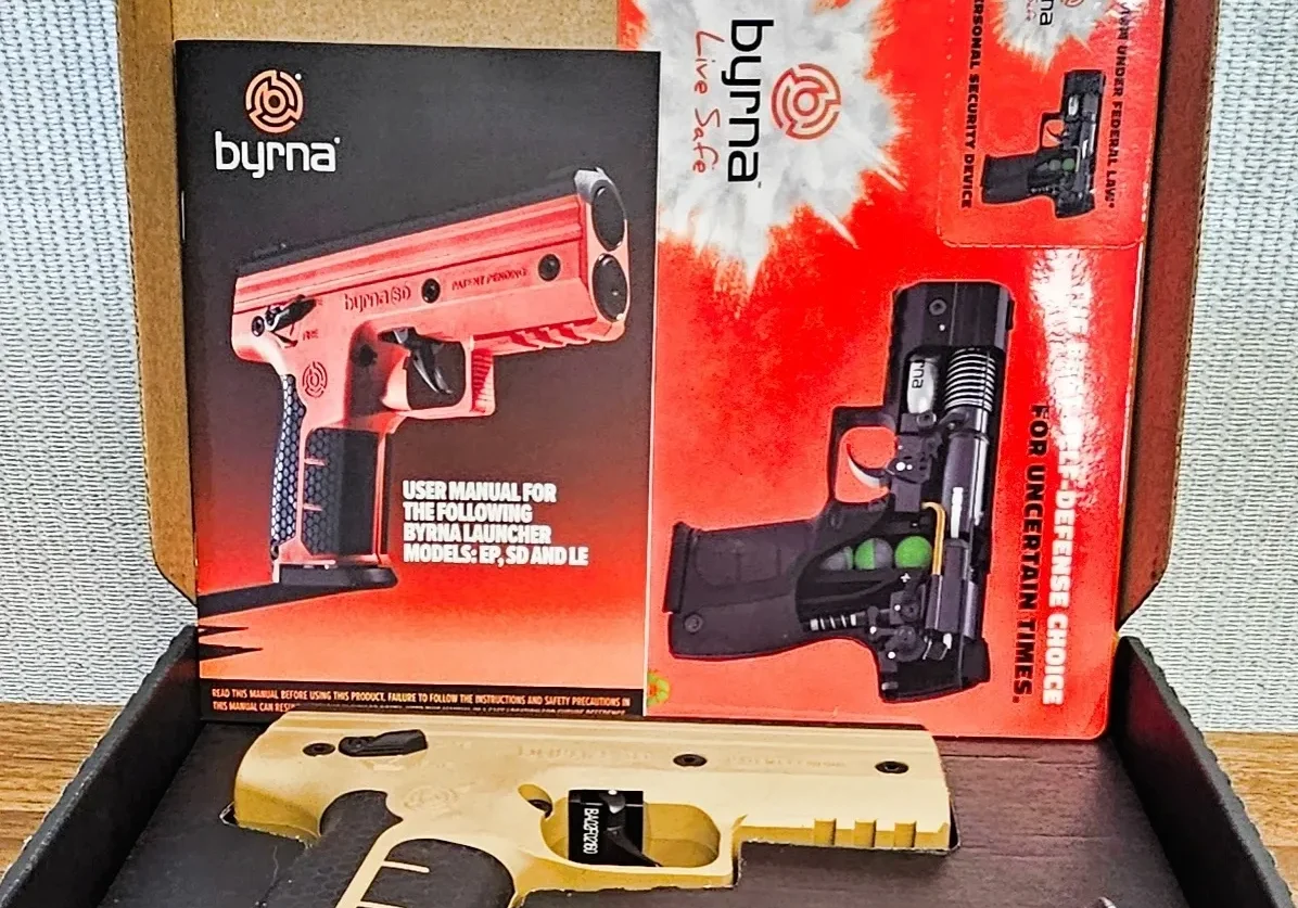 Byrna self-defense kit with manuals.